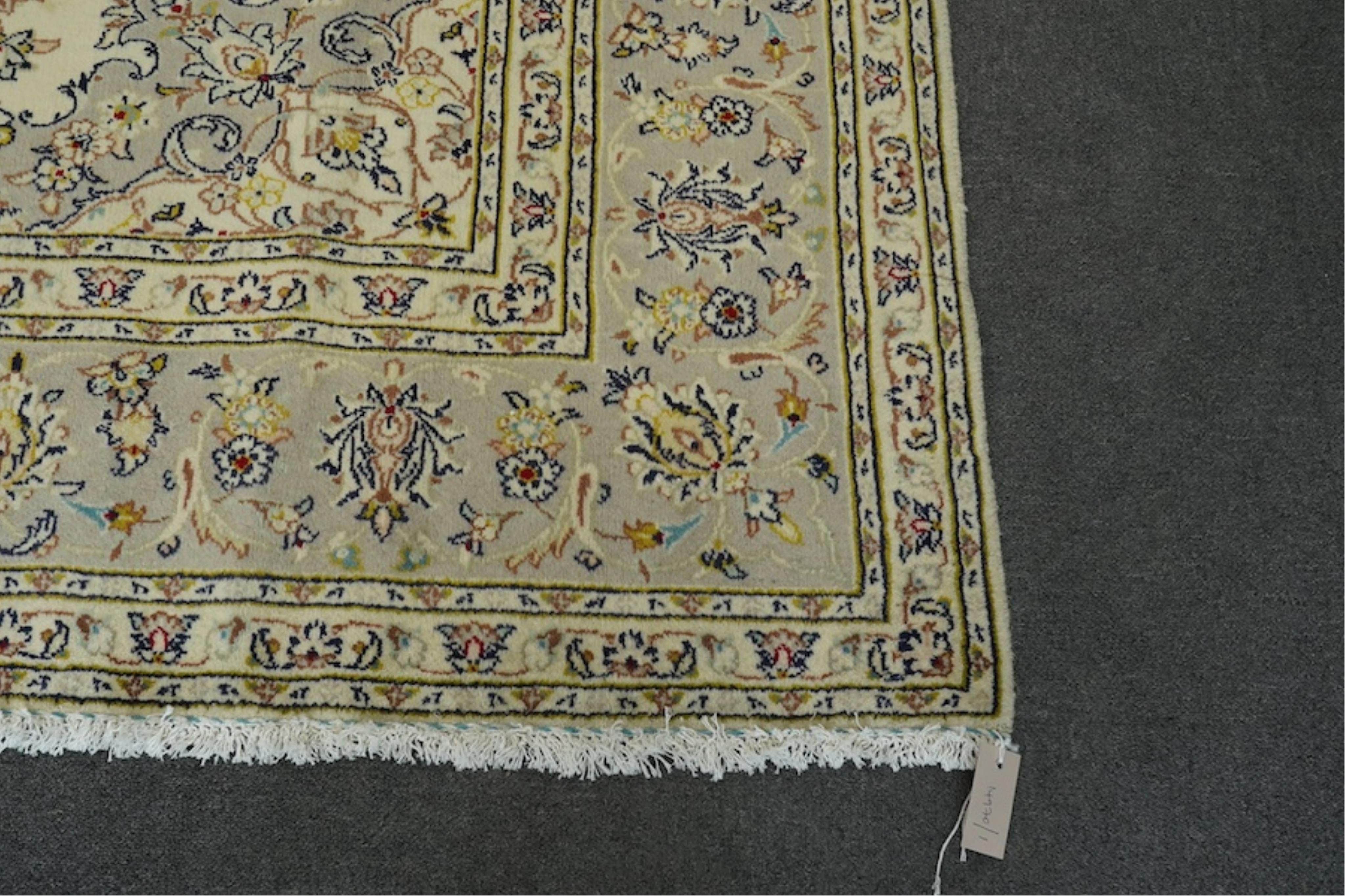 A Kashan ivory ground carpet, 300 x 195cm. Condition - good